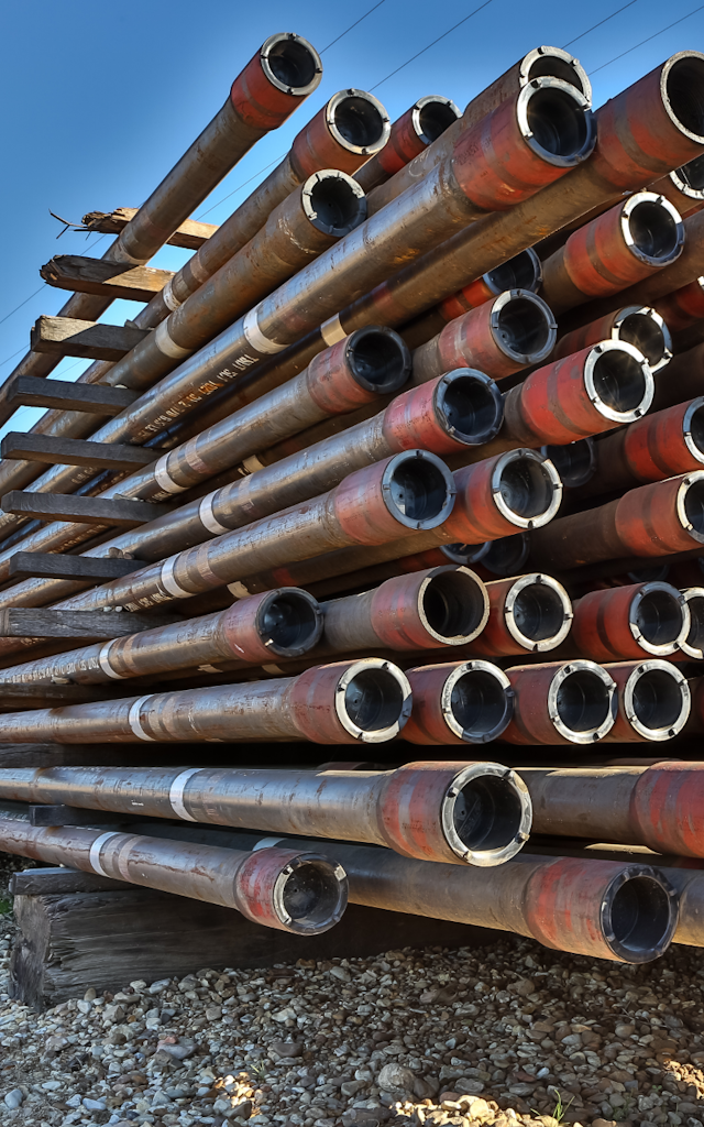 stacked pipes in an industrial yard